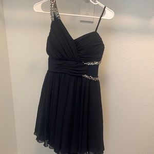 This is a one shoulder navy blue dress in the size nine.